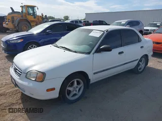 2001 Suzuki Esteem GL z VIN JS2GB41S515210894, wystawiony jako IAAI lot #42234772 z przebiegiem 180 182 mil mil oraz . Historia ofert i sprzedaży dostępna na DreamBid. Obrazek 2.
