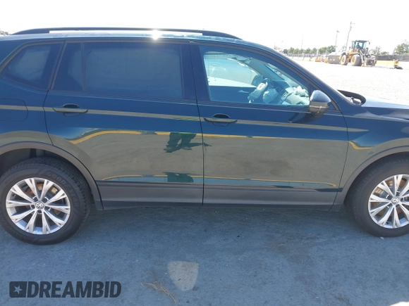 2018 Volkswagen Tiguan S with VIN 3VV1B7AX1JM165641, listed as a IAAI auction lot 42699622 with 75,354 mi miles and . Bid and sale history available at DreamBid. Image 12.