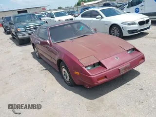 1986 Nissan 300ZX GS z VIN JN1HZ16SXGX088521, wystawiony jako IAAI lot #42853436 z przebiegiem 188 616 mil mil oraz . Historia ofert i sprzedaży dostępna na DreamBid. Obrazek 1.