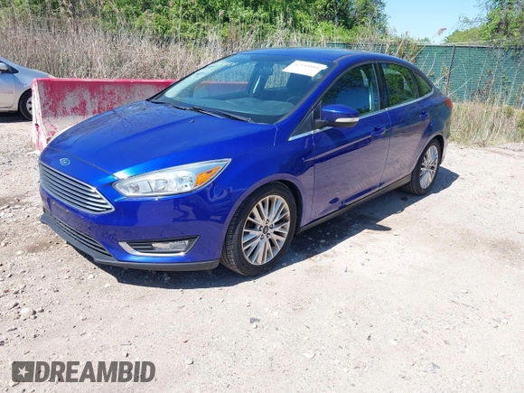 2015 Ford Focus Titanium with VIN 1FADP3J20FL304828, listed as a IAAI auction lot 42144101 with 199,715 mi miles and . Bid and sale history available at carsss.com. Image 2.