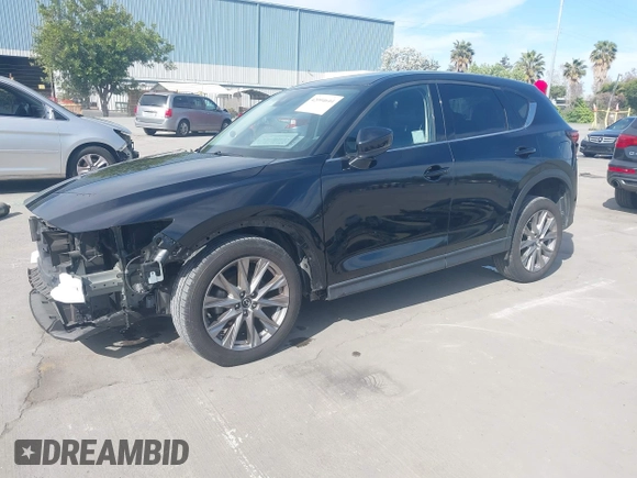 2021 Mazda CX-5 Grand Touring with VIN JM3KFBDM4M1426197, listed as a IAAI auction lot 42004644 with 43,814 mi miles. Bid and sale history available at carsss.com. Image 22.