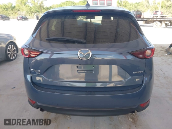2021 Mazda CX-5 Touring with VIN JM3KFBCM3M0406787, listed as a IAAI auction lot 41800564 with 42,254 mi miles and . Bid and sale history available at carsss.com. Image 17.
