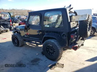 2004 Jeep Wrangler Rubicon with VIN 1J4FA69S74P785297, listed as a Copart auction lot 47332944 with 61,323 mi miles and Salvage Title. Bid and sale history available at carsss.com. Image 2.