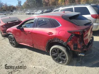 2021 Mazda CX-30 Premium with VIN 3MVDMBDY0MM312354, listed as a Copart auction lot 77112334 with 47,351 mi miles and Salvage Title. Bid and sale history available at carsss.com. Image 2.