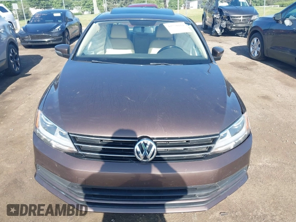 2015 Volkswagen Jetta Sport z VIN 3VWD17AJ5FM411217, wystawiony jako IAAI lot #42563776 z przebiegiem 84 520 mil mil oraz . Historia ofert i sprzedaży dostępna na DreamBid. Obrazek 12.