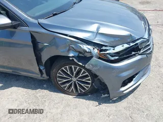 2019 Volkswagen Jetta SEL z VIN 3VWE57BU0KM110267, wystawiony jako IAAI lot #42161272 z przebiegiem 63 955 mil mil oraz . Historia ofert i sprzedaży dostępna na DreamBid. Obrazek 6.