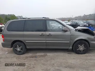 2005 Kia Sedona LX with VIN KNDUP132056674430, listed as a IAAI auction lot 41553321 with 136,734 mi miles. Bid and sale history available at carsss.com. Image 13.