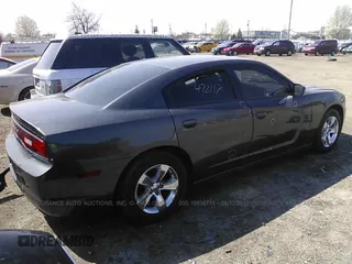 2013 Dodge Charger SE with VIN 2C3CDXBG7DH637736, listed as a IAAI auction lot 19538711 with 80,920 mi miles. Bid and sale history available at carsss.com. Image 4.