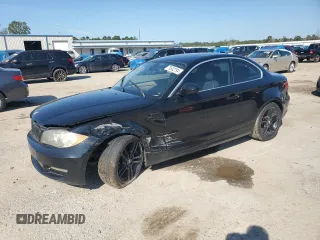 2011 BMW 1 Series 128i with VIN WBAUP7C51BVP21802, listed as a Copart auction lot 79502794 with 126,976 mi miles and Salvage Title. Bid and sale history available at DreamBid. Image 1.