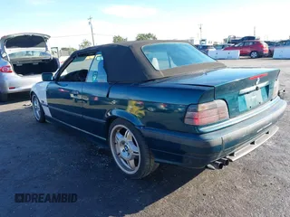 1997 BMW 3-Series 328IC with VIN WBABK8323VET99072, listed as a IAAI auction lot 40669447 with 135,584 mi miles. Bid and sale history available at carsss.com. Image 3.