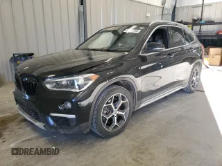 2017 BMW X1 xDrive28i with VIN WBXHT3Z31H4A65698, listed as a Copart auction lot 69937704 with 119,138 mi miles and Salvage Title. Bid and sale history available at carsss.com. Image 1.