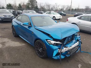 2021 BMW M2 Competition with VIN WBS2U7C02M7H63454, listed as a IAAI auction lot 41063808 with 15,047 mi miles. Bid and sale history available at carsss.com. Image 1.