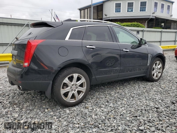 2014 Cadillac SRX Performance Collection with VIN 3GYFNFE33ES687941, listed as a Copart auction lot 57726675 with 164,059 mi miles and Clean title. Bid and sale history available at DreamBid. Image 3.
