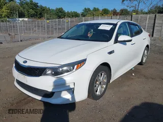 2016 Kia Optima LX with VIN 5XXGT4L39GG058653, listed as a IAAI auction lot 40313026 with 94,933 mi miles. Bid and sale history available at carsss.com. Image 2.