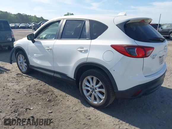 2015 Mazda CX-5 Grand Touring with VIN JM3KE2DY5F0498718, listed as a IAAI auction lot 42070000 with 129,327 mi miles. Bid and sale history available at carsss.com. Image 3.
