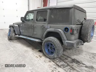2020 Jeep Wrangler Unlimited Sport Altitude with VIN 1C4HJXDG7LW167909, listed as a IAAI auction lot 41413004 with 69,631 mi miles and . Bid and sale history available at DreamBid. Image 3.