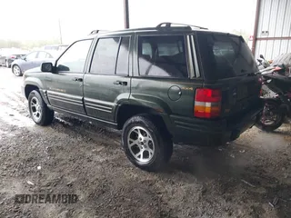 1997 Jeep Grand Cherokee Limited with VIN 1J4GZ78Y5VC723429, listed as a IAAI auction lot 42012836 with 231,126 mi miles. Bid and sale history available at carsss.com. Image 3.