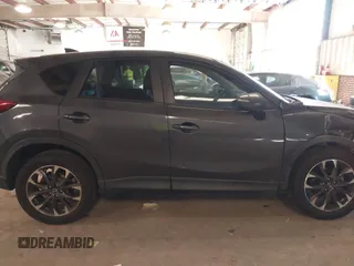 2016 Mazda CX-5 Grand Touring with VIN JM3KE2DYXG0846787, listed as a IAAI auction lot 41346364 with 113,553 mi miles. Bid and sale history available at carsss.com. Image 13.