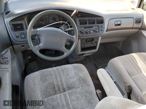 1999 Toyota Sienna LE with VIN 4T3ZF13C8XU108650, listed as a Copart auction lot 74476004 with 215,060 mi miles and Salvage Title. Bid and sale history available at carsss.com. Image 8.
