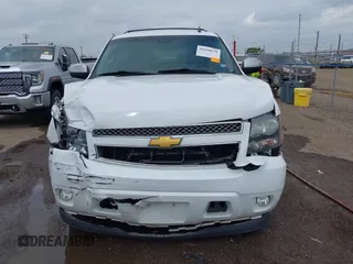 2014 Chevrolet Suburban LT with VIN 1GNSCJE04ER107836, listed as a IAAI auction lot 41698679 with 106,139 mi miles. Bid and sale history available at carsss.com. Image 12.