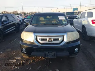 2009 Honda Pilot EX-L with VIN 5FNYF48659B012032, listed as a IAAI auction lot 41801232 with 205,636 mi miles and . Bid and sale history available at carsss.com. Image 12.