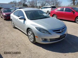 2009 Mazda 6 i Touring with VIN 1YVHP82A795M31562, listed as a IAAI auction lot 41970484 with 128,724 mi miles. Bid and sale history available at carsss.com. Image 1.