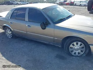 2004 Mercury Grand Marquis LS Premium with VIN 2MEFM75W14X606756, listed as a IAAI auction lot 41572470 with 106,498 mi miles. Bid and sale history available at carsss.com. Image 13.