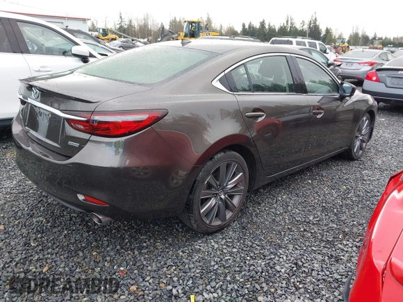 2018 Mazda 6 Grand Touring with VIN JM1GL1TYXJ1301545, listed as a IAAI auction lot 41131114 with 34,089 mi miles and . Bid and sale history available at DreamBid. Image 4.