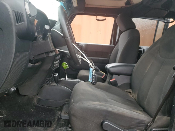 2016 Jeep Wrangler Unlimited Sport z VIN 1C4BJWDG4GL194296, wystawiony jako Copart lot #59397285 z przebiegiem 174 343 mil mil oraz Szkoda całkowita • Salvage title. Historia ofert i sprzedaży dostępna na DreamBid. Obrazek 7.