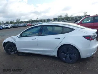 2023 Tesla Model 3 with VIN 5YJ3E1EA4PF405361, listed as a IAAI auction lot 41932723 with 28,487 mi miles. Bid and sale history available at carsss.com. Image 15.