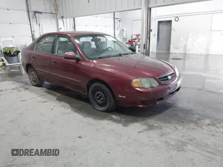 2003 Kia Spectra GS with VIN KNAFB161635101168, listed as a IAAI auction lot 41648034 with 127,113 mi miles. Bid and sale history available at carsss.com. Image 1.