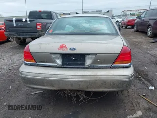 2003 Ford Crown Victoria LX z VIN 2FAFP74W13X120754, wystawiony jako IAAI lot #42212879 z przebiegiem 91 438 mil mil oraz . Historia ofert i sprzedaży dostępna na DreamBid. Obrazek 16.