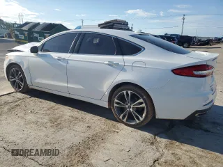 2020 Ford Fusion Titanium with VIN 3FA6P0D98LR176335, listed as a Copart auction lot 55323275 with 76,572 mi miles and Salvage title. Bid and sale history available at DreamBid. Image 2.