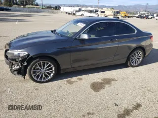 2015 BMW 2 Series 228i with VIN WBA1F5C50FV256459, listed as a Copart auction lot 56518723 with 65,653 mi miles. Bid and sale history available at carsss.com. Image 1.
