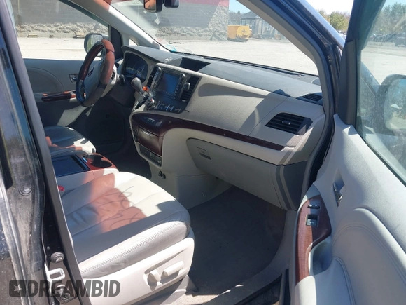 2011 Toyota Sienna XLE with VIN 5TDDK3DC8BS011975, listed as a IAAI auction lot 42112522 with 124,251 mi miles. Bid and sale history available at carsss.com. Image 5.