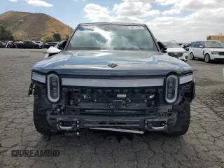 2022 Rivian R1S Launch Edition z VIN 7PDSGABL5NN001018, wystawiony jako Copart lot #56914725 z przebiegiem 26 156 mil mil oraz Szkoda całkowita • Salvage title. Historia ofert i sprzedaży dostępna na DreamBid. Obrazek 5.