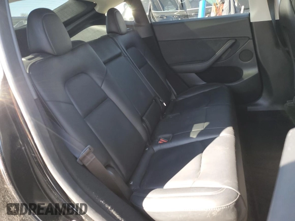 2023 Tesla Model Y Performance with VIN 7SAYGDEF7PF924355, listed as a Copart auction lot 47877055 with 64,663 mi miles and Salvage Title. Bid and sale history available at DreamBid. Image 12.