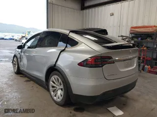 2018 Tesla Model X 75D with VIN 5YJXCDE28JF120932, listed as a IAAI auction lot 41899059 with 57,568 mi miles. Bid and sale history available at carsss.com. Image 3.