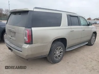 2015 GMC Yukon XL SLE z VIN 1GKS1GKC1FR155056, wystawiony jako IAAI lot #41517607 z przebiegiem 174 634 mil mil oraz . Historia ofert i sprzedaży dostępna na DreamBid. Obrazek 4.