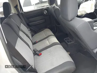 2008 Dodge Nitro SXT z VIN 1D8GT28K38W124264, wystawiony jako IAAI lot #41933674 z przebiegiem 292 756 mil mil oraz . Historia ofert i sprzedaży dostępna na DreamBid. Obrazek 8.