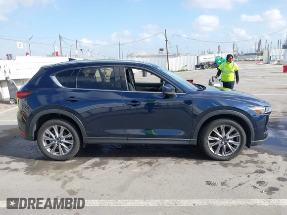 2021 Mazda CX-5 Grand Touring with VIN JM3KFBDM6M1312573, listed as a IAAI auction lot 41936739 with Not Provided miles and . Bid and sale history available at DreamBid. Image 12.