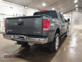2014 Nissan Titan S with VIN 1N6AA0EC6EN513801, listed as a IAAI auction lot 41762295 with 128,412 mi miles and . Bid and sale history available at DreamBid. Image 4.