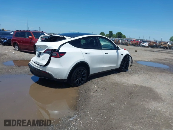 2023 Tesla Model Y Long Range z VIN 7SAYGDEE9PF753051, wystawiony jako IAAI lot #39615839 z przebiegiem Nie podano mil oraz . Historia ofert i sprzedaży dostępna na DreamBid. Obrazek 4.