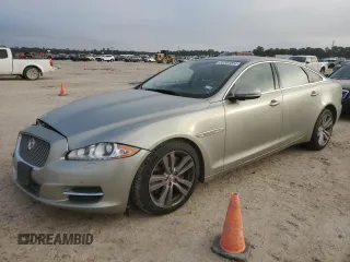 2014 Jaguar XJ with VIN SAJWA2GZ8E8V60138, listed as a Copart auction lot 86384064 with 137,190 mi miles and Salvage Title. Bid and sale history available at carsss.com. Image 1.