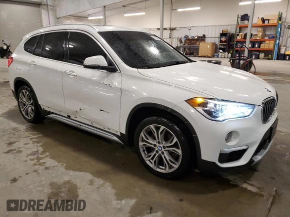 2018 BMW X1 xDrive28i with VIN WBXHT3C30J5K29917, listed as a Copart auction lot 56165845 with 131,876 mi miles and Salvage title. Bid and sale history available at DreamBid. Image 4.