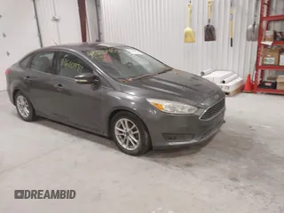 2016 Ford Focus SE z VIN 1FADP3F23GL263928, wystawiony jako IAAI lot #41610983 z przebiegiem 119 064 mil mil oraz . Historia ofert i sprzedaży dostępna na DreamBid. Obrazek 1.
