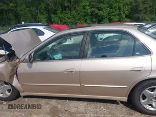 2000 Honda Accord EX z VIN 1HGCG1653YA030361, wystawiony jako IAAI lot #42268744 z przebiegiem 53 809 mil mil oraz . Historia ofert i sprzedaży dostępna na DreamBid. Obrazek 14.