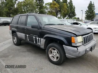 1998 Jeep Grand Cherokee Laredo with VIN 1J4FX58S0WC305329, listed as a Copart auction lot 76777264 with 251,942 mi miles and Clean Title. Bid and sale history available at carsss.com. Image 4.