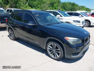2014 BMW X1 sDrive28i with VIN WBAVM1C5XEVW51666, listed as a IAAI auction lot 42083936 with 176,465 mi miles. Bid and sale history available at carsss.com. Image 1.