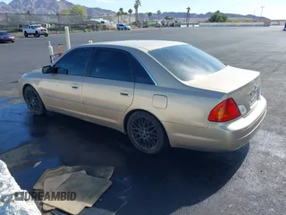 2001 Toyota Avalon XL w/Bucket Seats with VIN 4T1BF28BX1U117793, listed as a IAAI auction lot 42165172 with 247,435 mi miles. Bid and sale history available at carsss.com. Image 3.